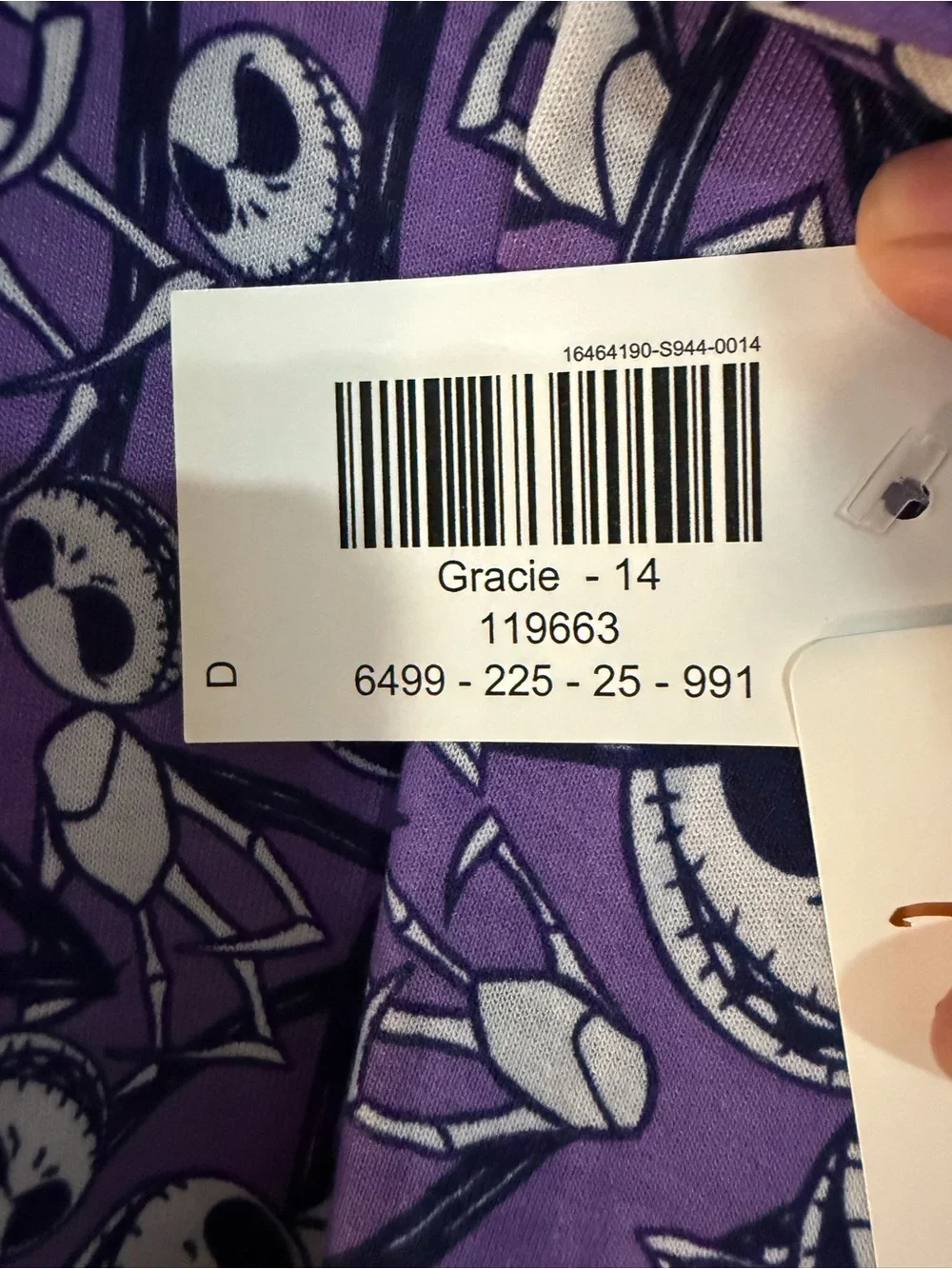 LuLaRoe Purple Short Sleeve Shirt with Black & White Skull Faces